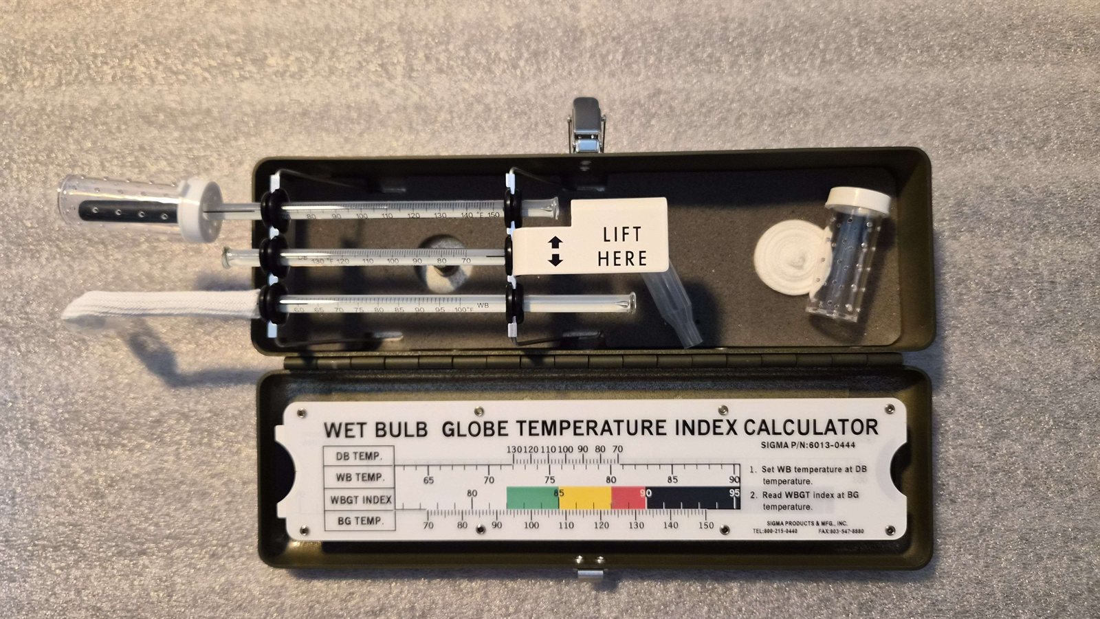 Sigma WBGT Kit — open case with wet bulb, dry bulb, and black globe thermometers and slide rule calculator
