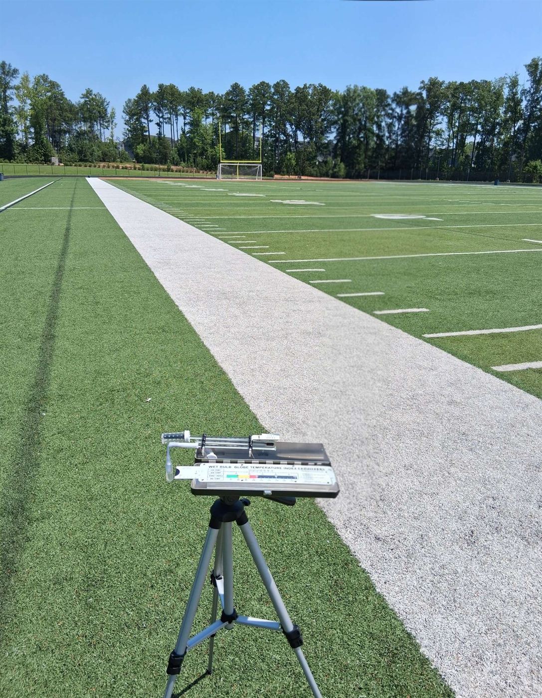 Standard WBGT Kit on tripod set up on the sideline of an athletic field